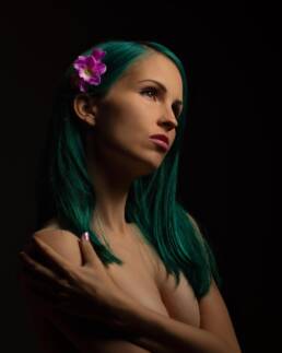 Photo of a girl with green hair by Marcel Lecours.