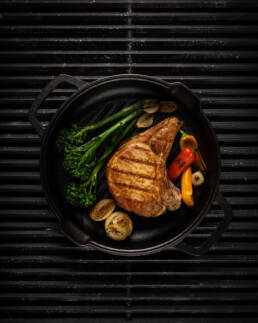 Photo of a grilled pork chop dish by Marcel Lecours.